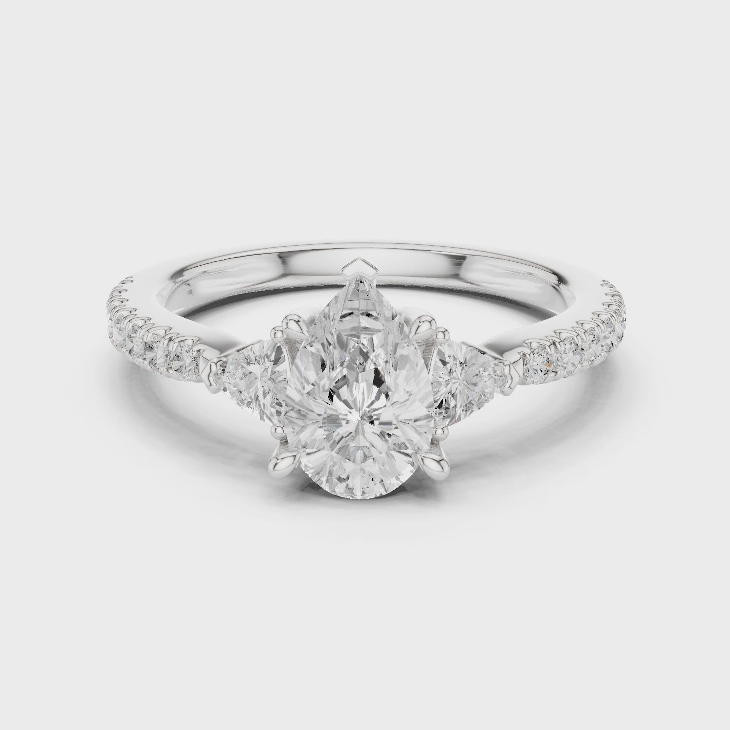 Pear Cut Three-Stone Engagement Ring with Pavé Band