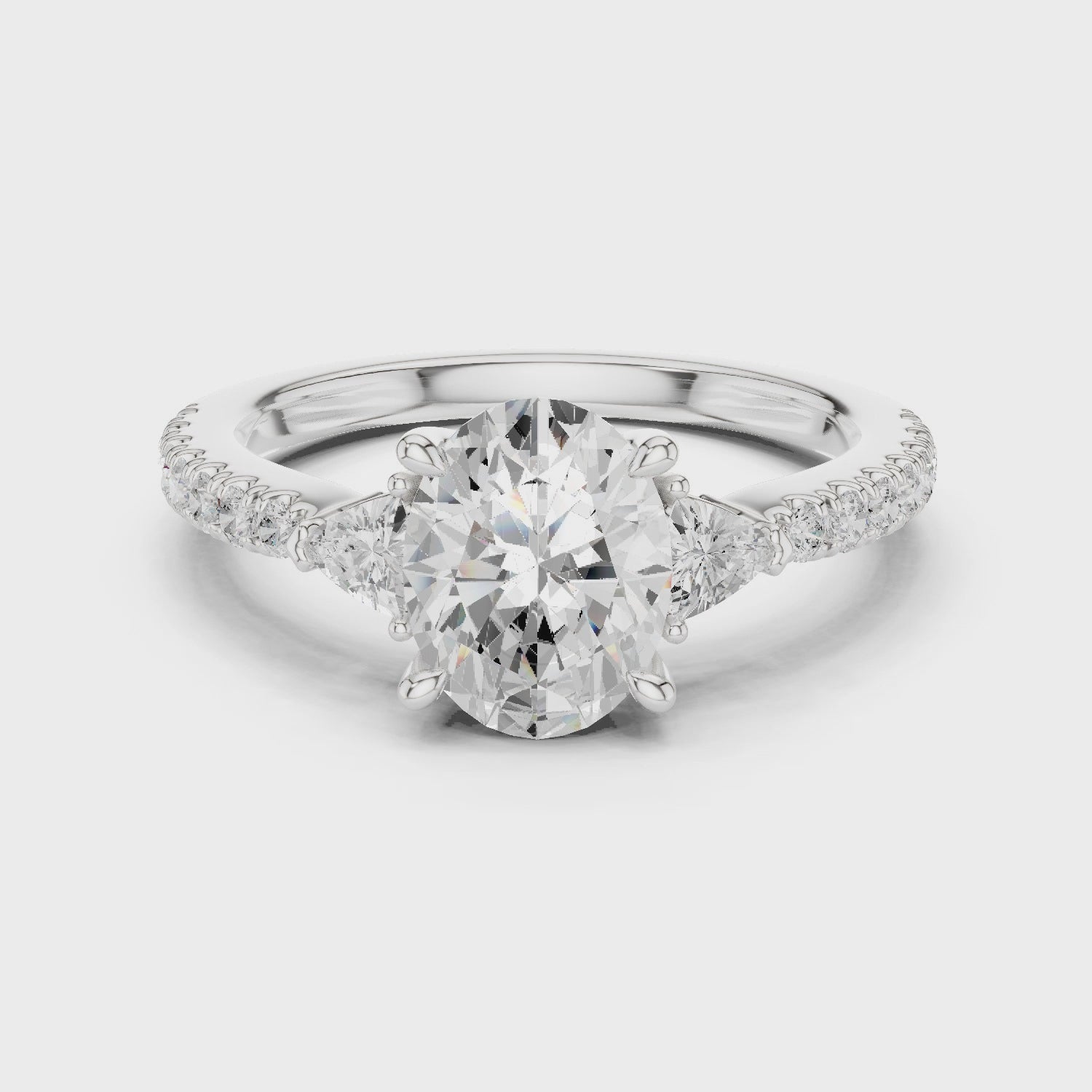 Oval Cut Three-Stone Engagement Ring with Pavé Band