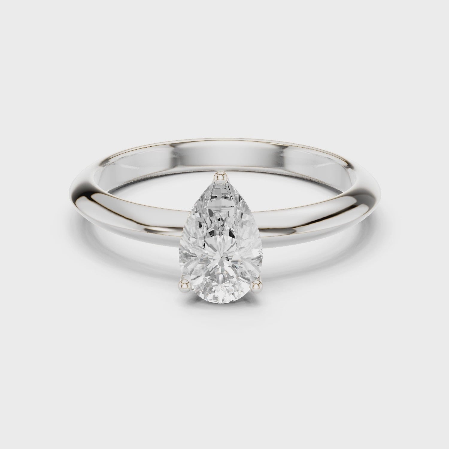 Pear Cut Solitaire Engagement Ring with Plain Band