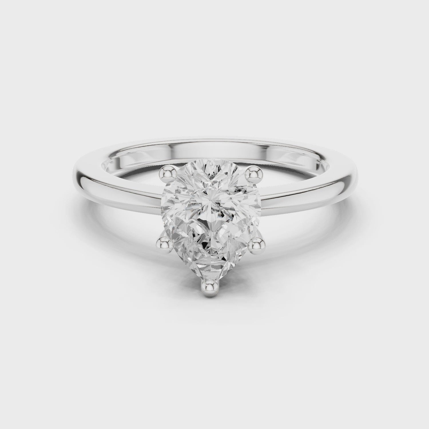 Pear Cut Solitaire Engagement Ring with Plain Band