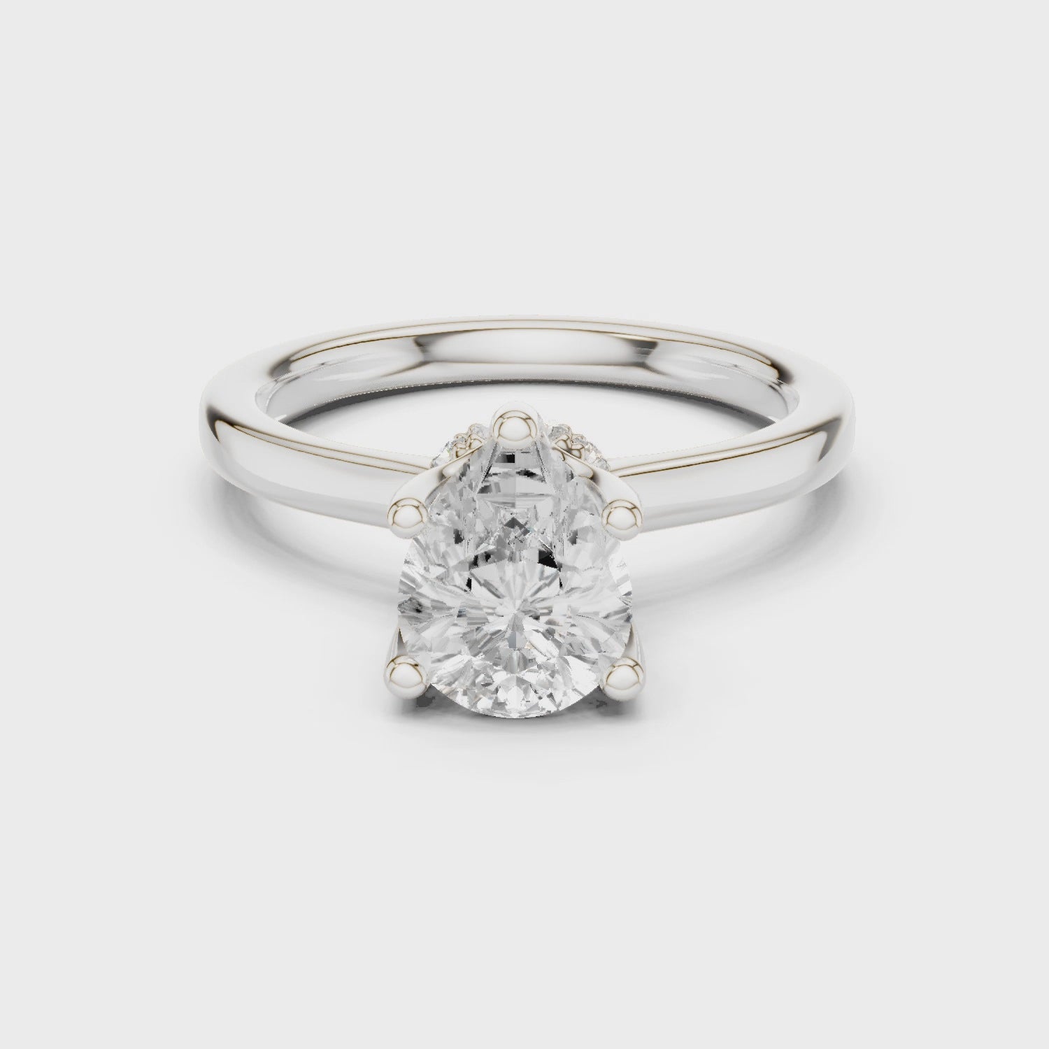Pear Cut Solitaire Engagement Ring with Hidden Halo and Cathedral Shank