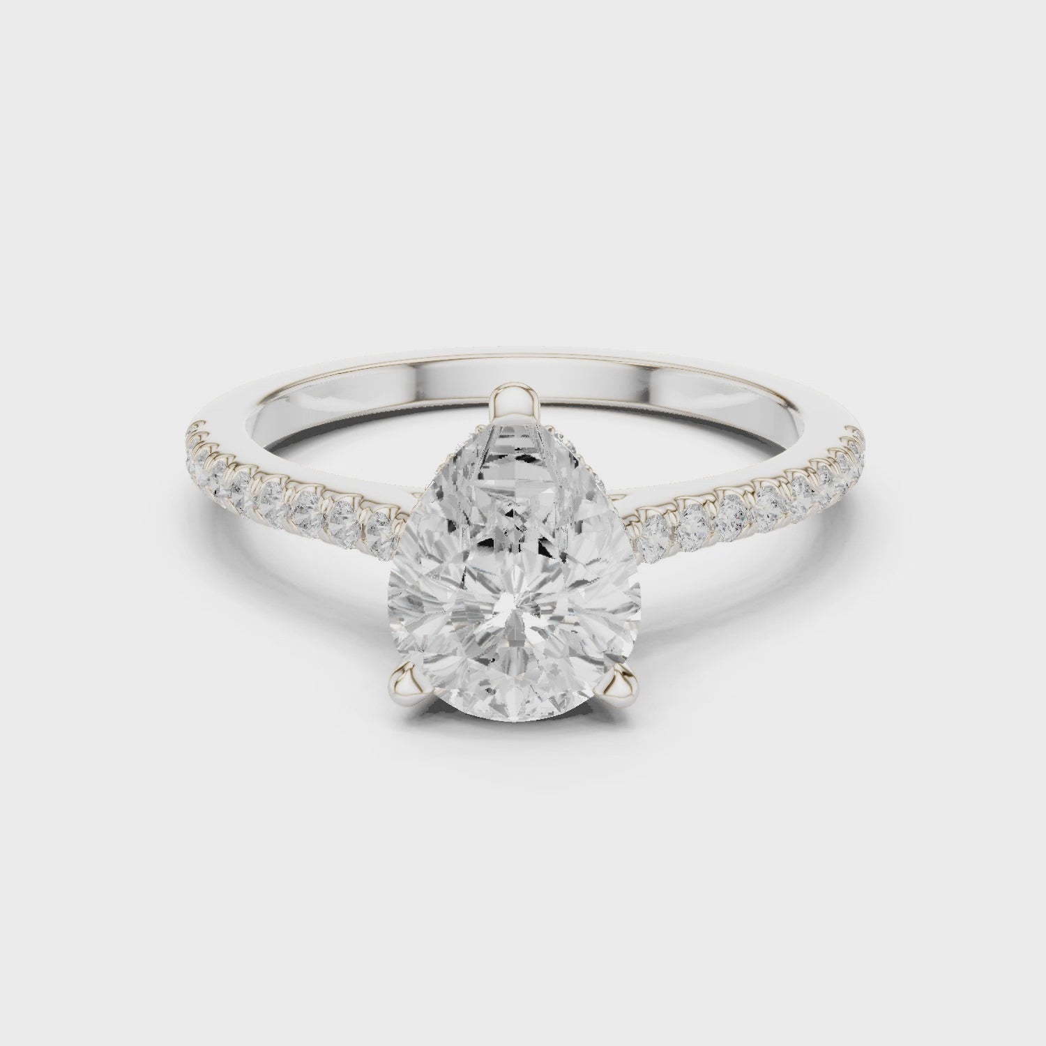 Pear Cut Solitaire Engagement Ring with Pavé Diamond Band and Hidden Halo