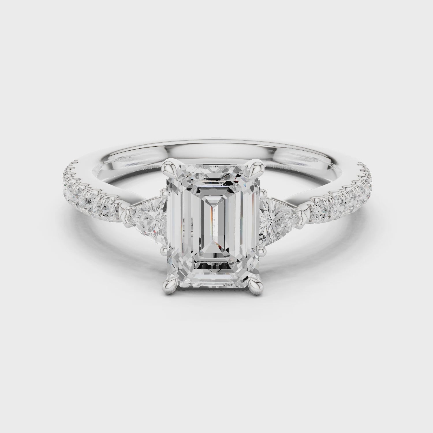 Emerald Cut Three-Stone Engagement Ring with Pavé Band