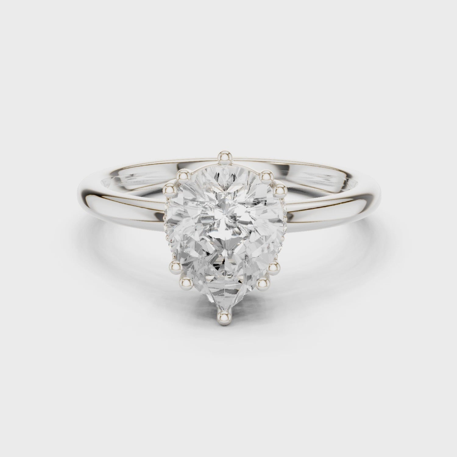 Pear Cut Solitaire Engagement Ring with Plain Band