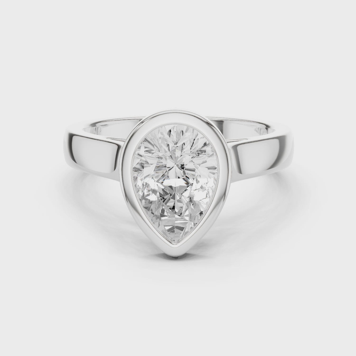 Pear Cut Solitaire Engagement Ring with Bezel Setting