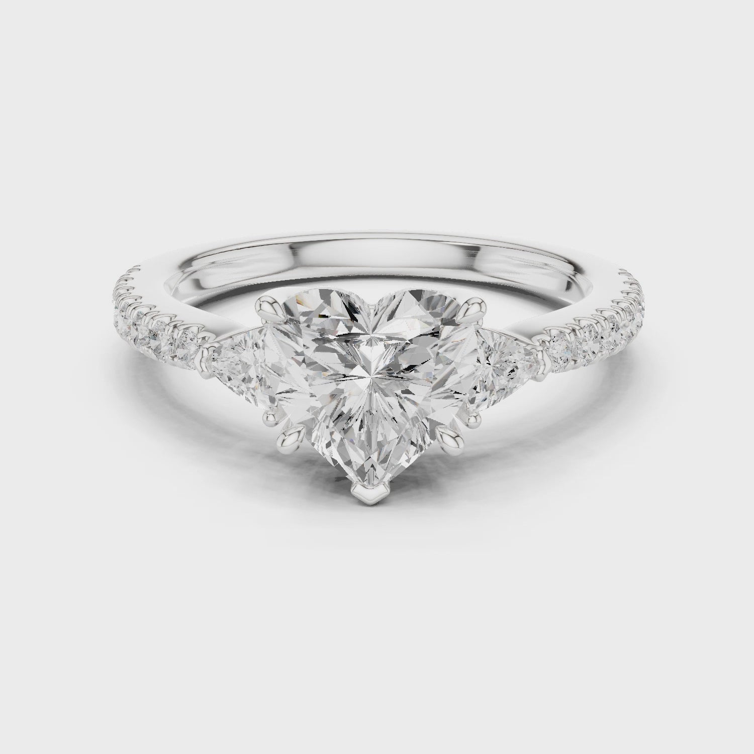 Heart Cut Three-Stone Engagement Ring with Pavé Band
