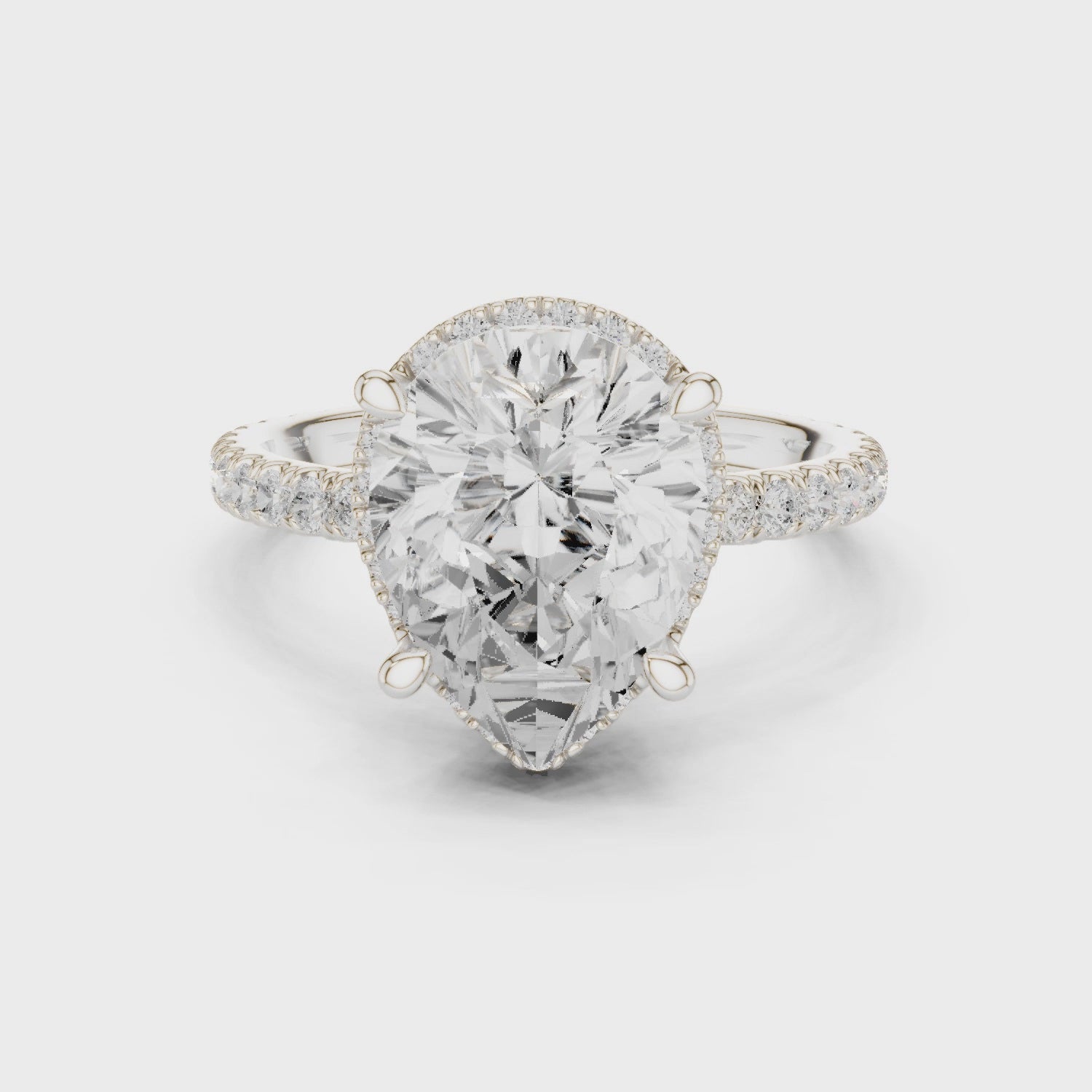 Pear Cut Engagement Ring with Hidden Halo